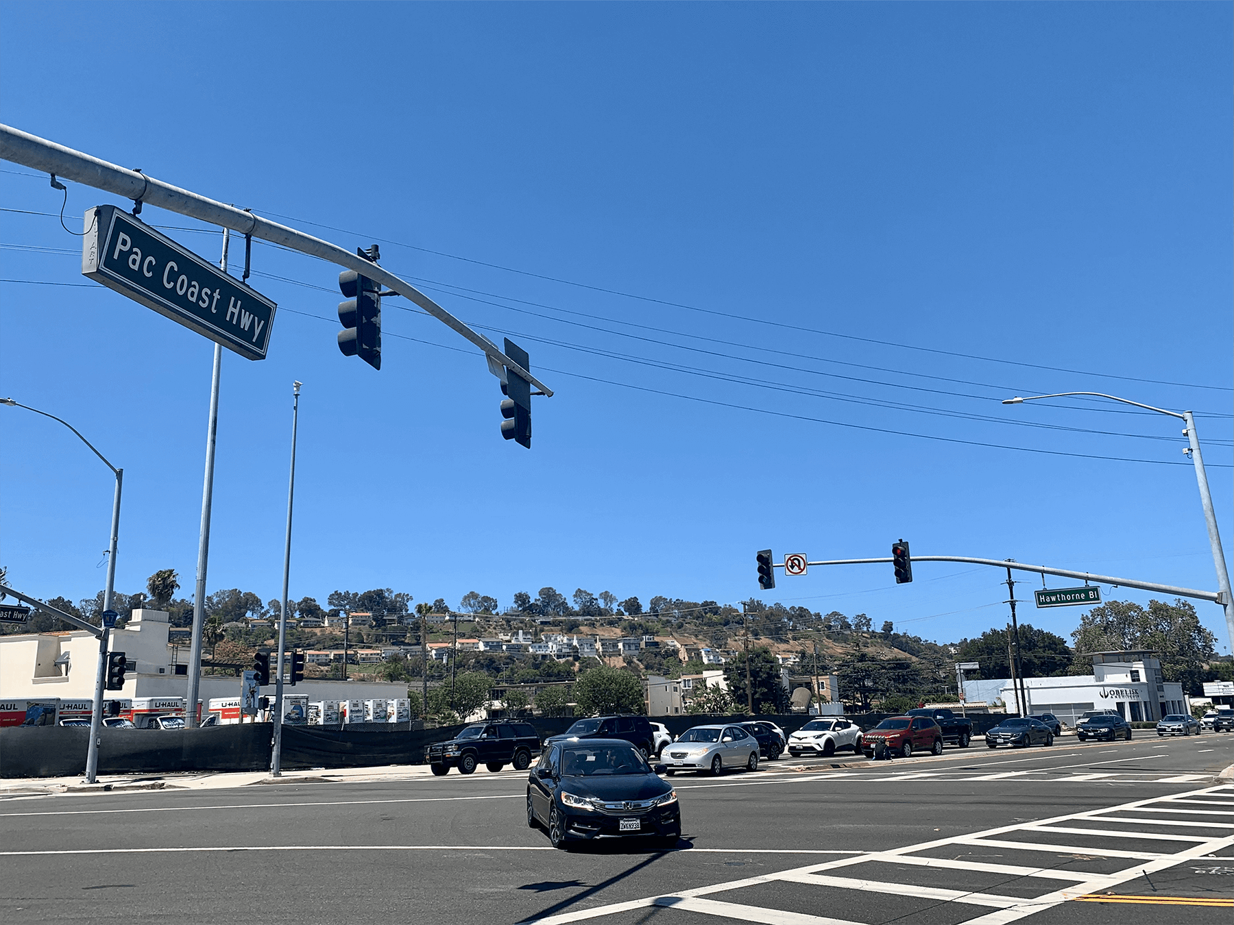 A wideshot of the instersection of PCH & HawthorneBlvd., focusing on the PCH Street Sign